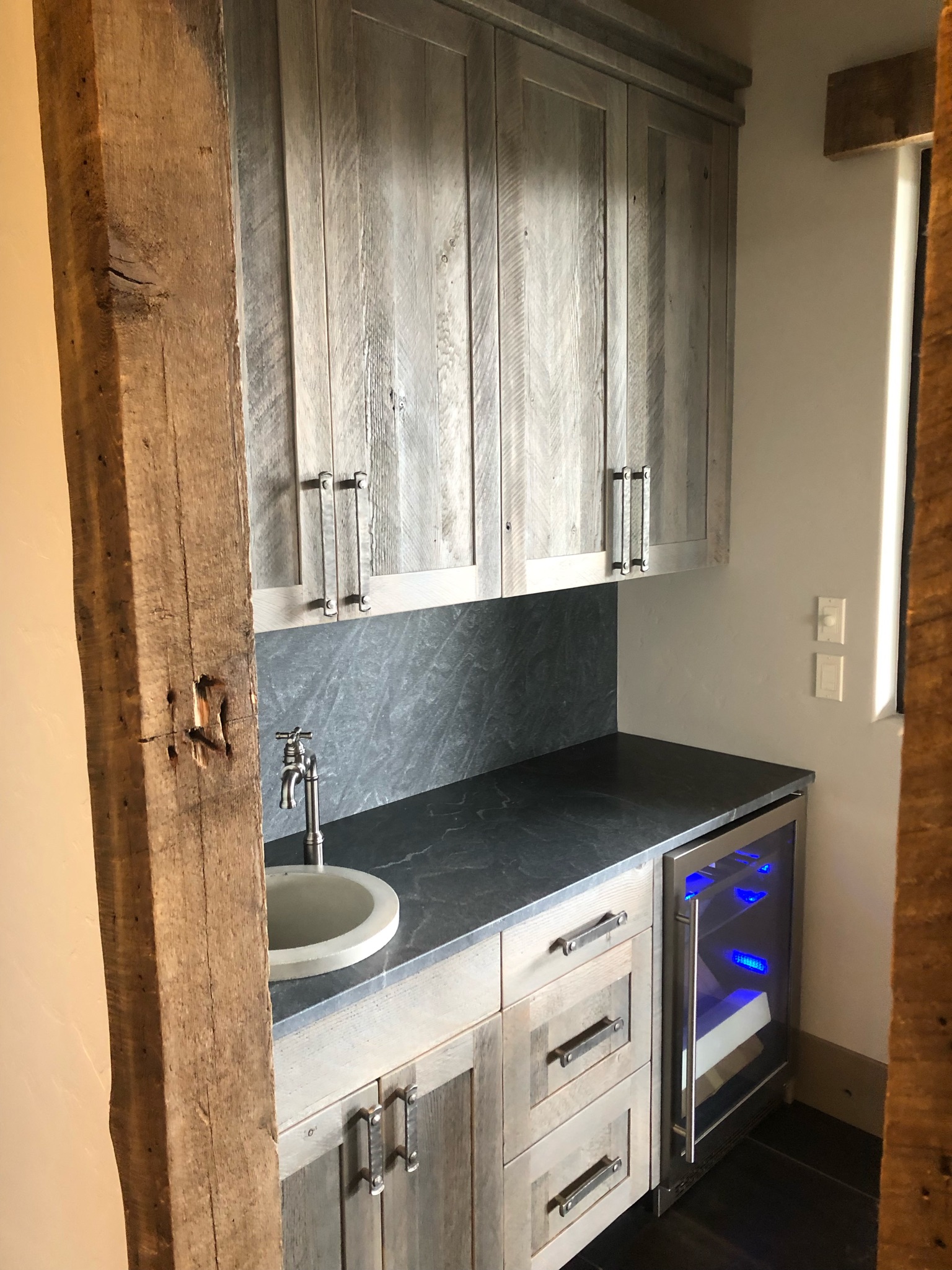 Reclaimed wood cabinets and wet bar